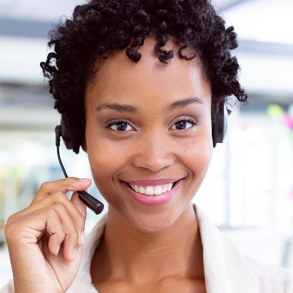 woman at help desk smiling